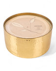 Gold candle container with beige lid featuring leaf design and 'Awaken' text on a white background