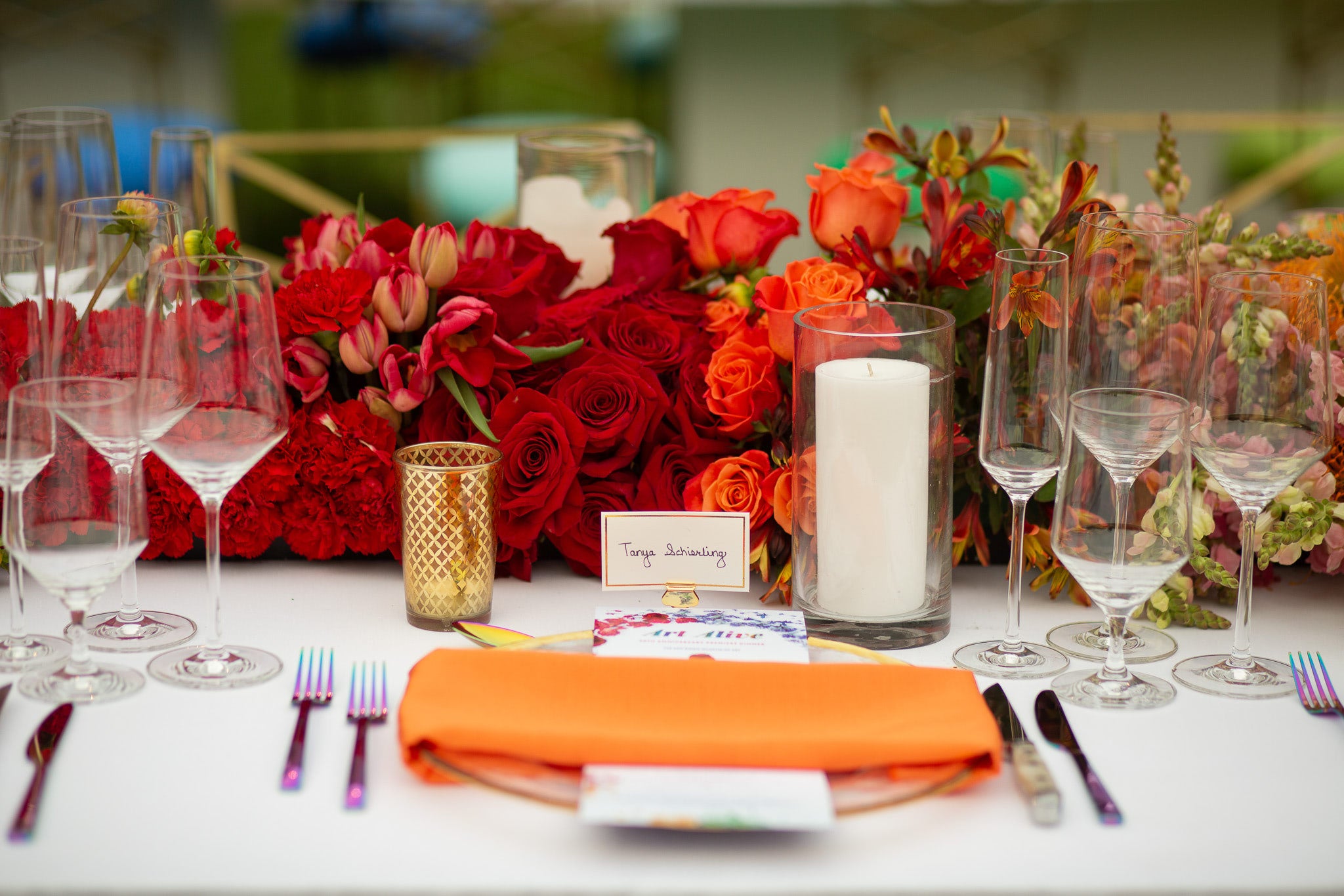 Orange Seating and Flowers from SDMA Art Alive Colors Dinner from Green Fresh Florals + Plants