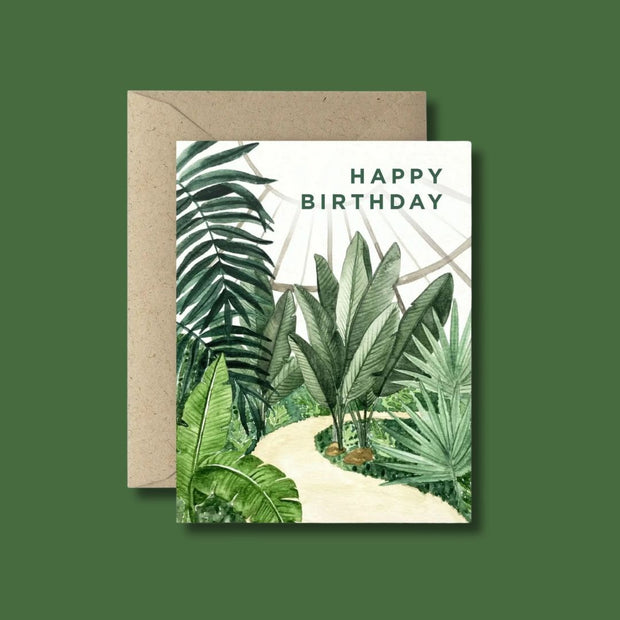Tropical plant-themed birthday card with 'Happy Birthday' text on a green background